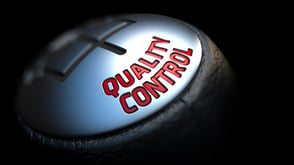 Quality Control - Red Text on Car's Shift Knob on Black Background. Close Up View. Selective Focus..jpeg